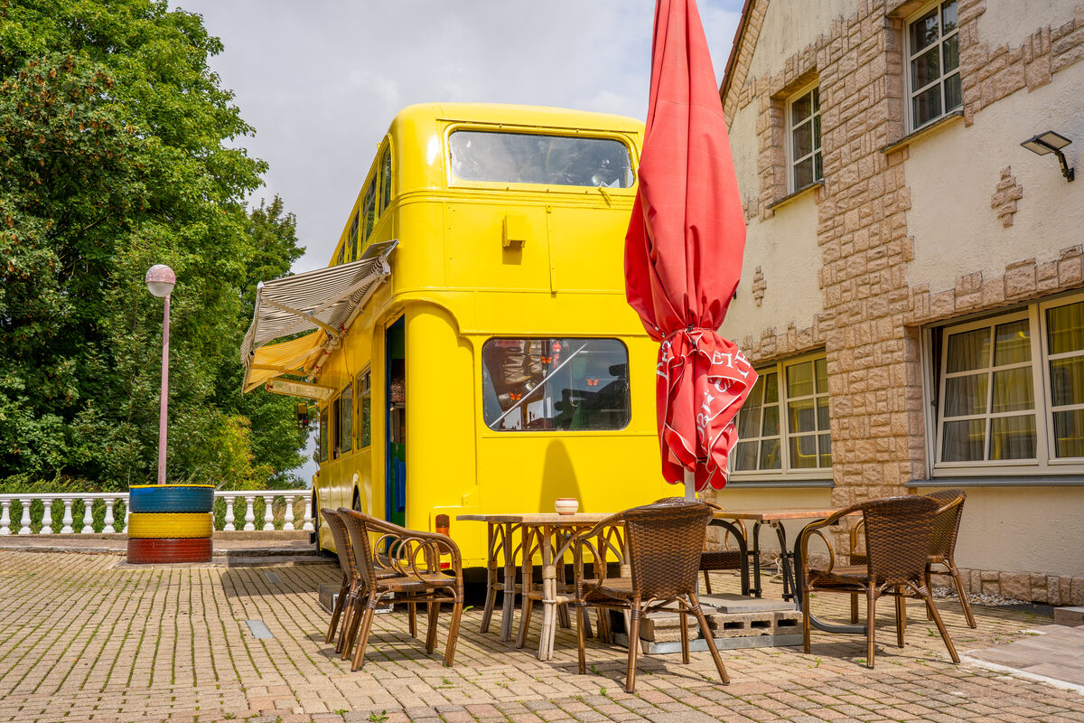 Terrace by the yellow double-decker bus